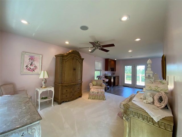 bedroom featuring french doors, light carpet, access to outside, and ceiling fan