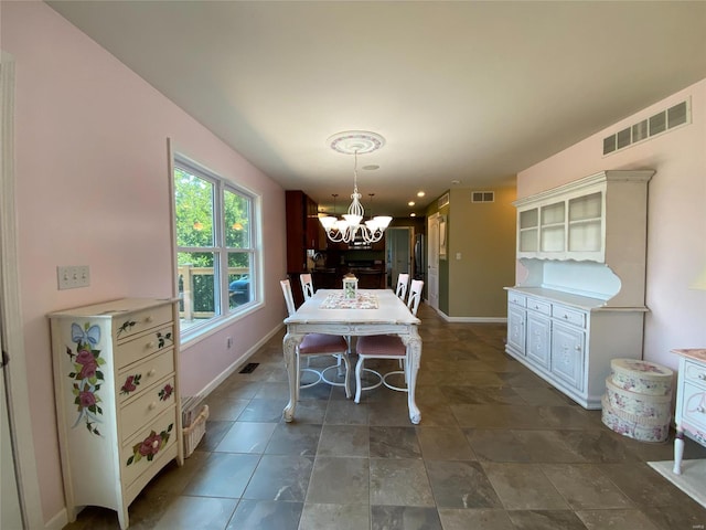 dining space featuring a chandelier