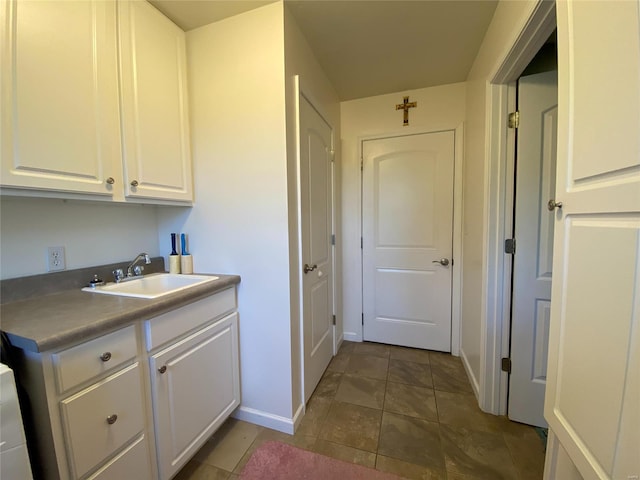 interior space featuring tile patterned floors and sink