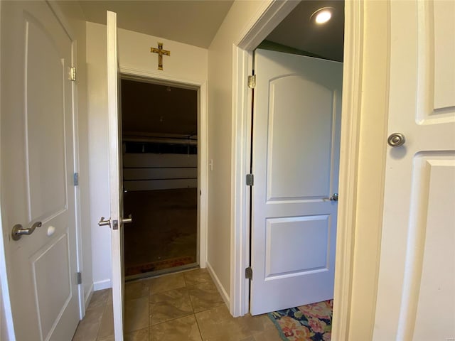 hallway featuring light tile patterned flooring