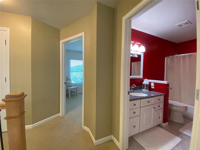 bathroom featuring vanity, a shower with shower curtain, and toilet