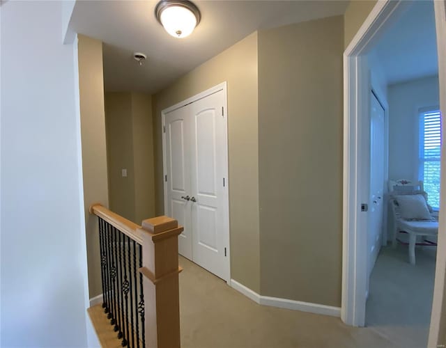 hallway with light carpet