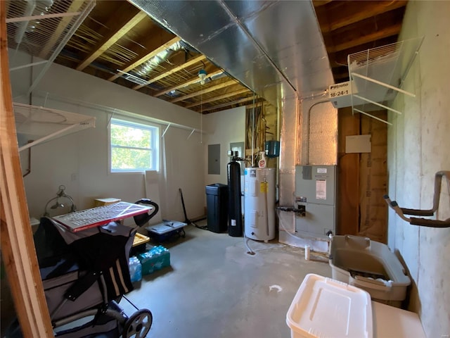 basement with electric water heater and electric panel