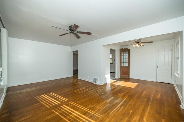 unfurnished living room featuring baseboards, a ceiling fan, wood finished floors, and visible vents