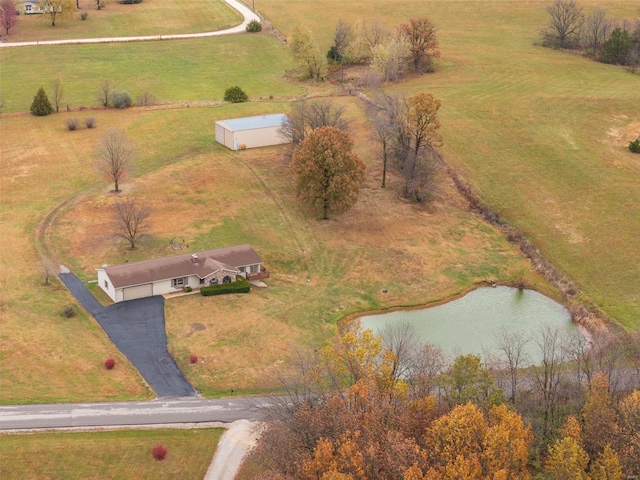 birds eye view of property with a rural view and a water view