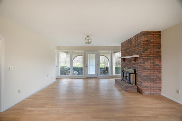 unfurnished living room featuring light wood-type flooring