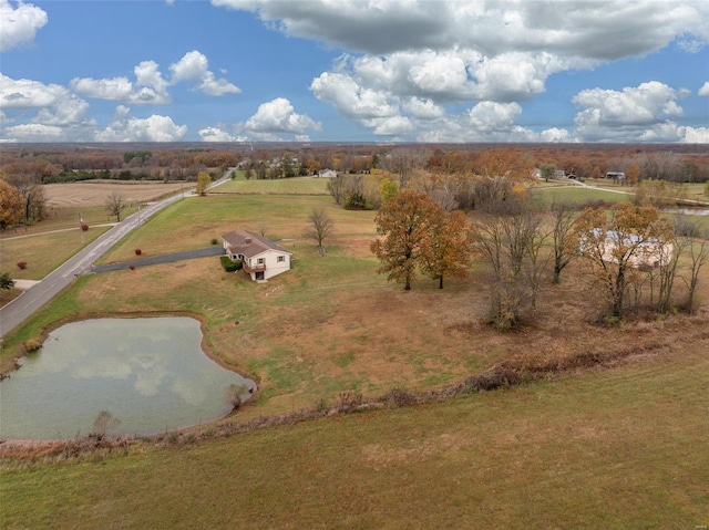 birds eye view of property with a water view and a rural view