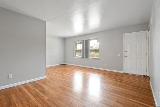 unfurnished room featuring light hardwood / wood-style flooring