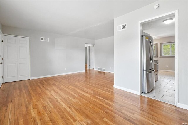 unfurnished room featuring light wood-type flooring