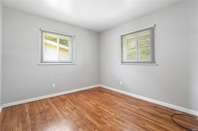 empty room featuring hardwood / wood-style flooring