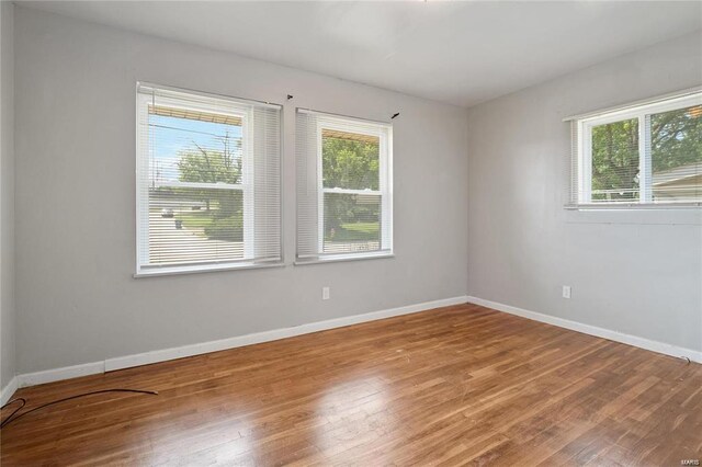 spare room featuring hardwood / wood-style flooring