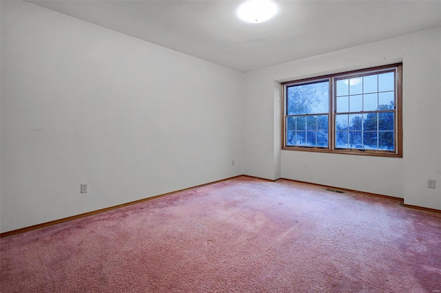 unfurnished room featuring carpet floors