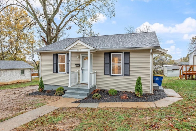 bungalow-style house with a front yard