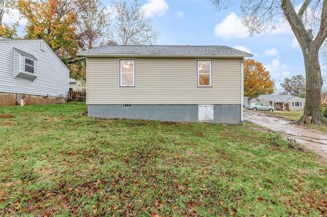 view of side of home featuring a yard