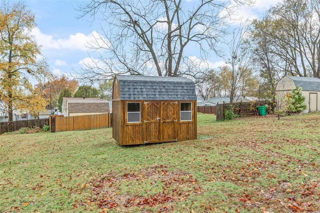 view of outbuilding featuring a lawn