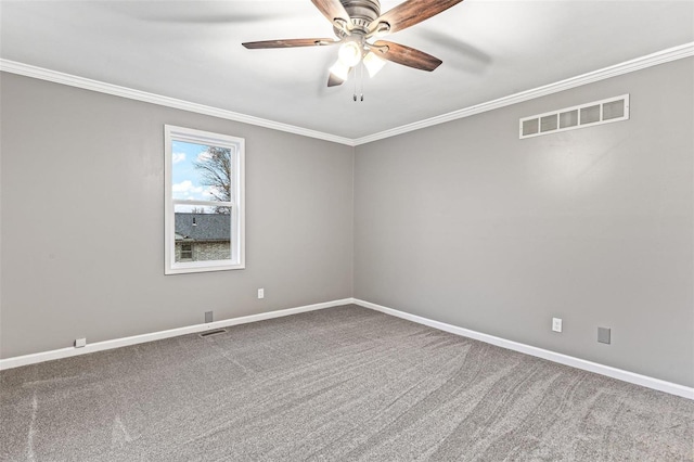 carpeted spare room with ornamental molding and ceiling fan