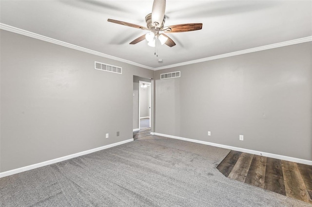 spare room with ceiling fan, carpet, and ornamental molding