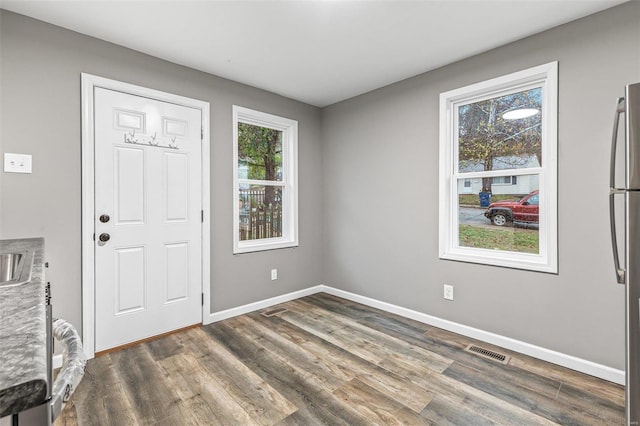 entrance foyer featuring dark hardwood / wood-style floors