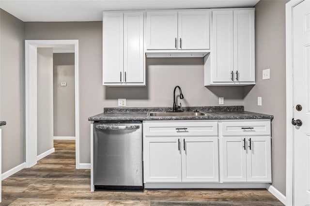 kitchen featuring white cabinetry and dishwasher