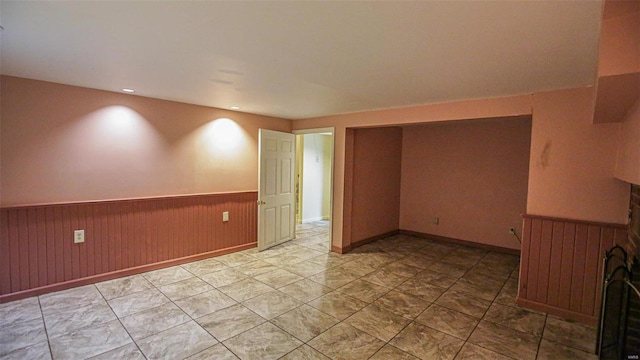 empty room featuring wooden walls