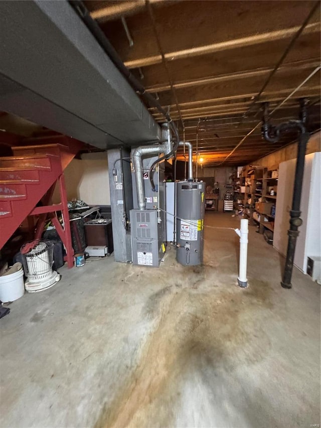 basement featuring heating unit and water heater