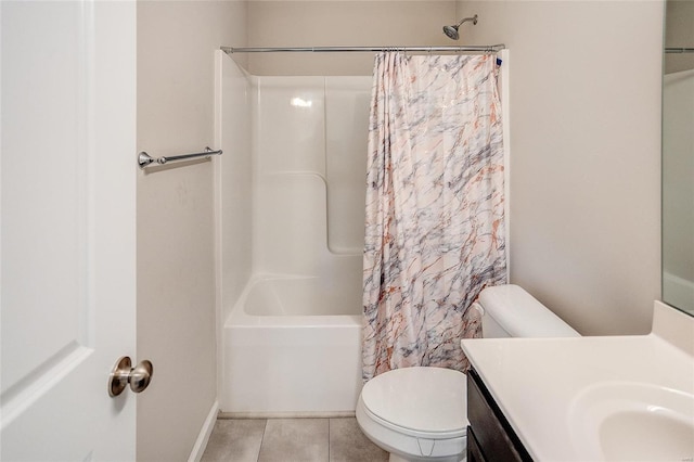 full bathroom featuring tile patterned flooring, shower / bath combo with shower curtain, vanity, and toilet