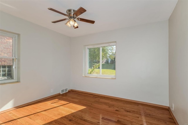 spare room featuring ceiling fan and wood-type flooring