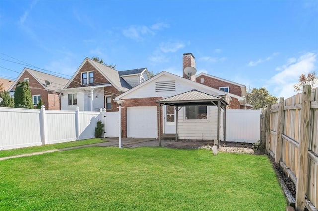 rear view of property with a gazebo and a lawn