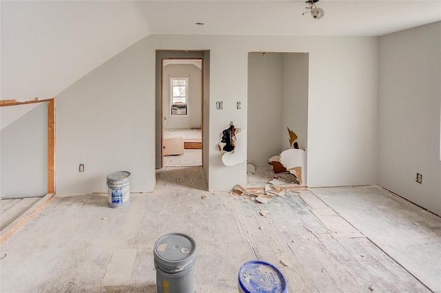 additional living space with vaulted ceiling