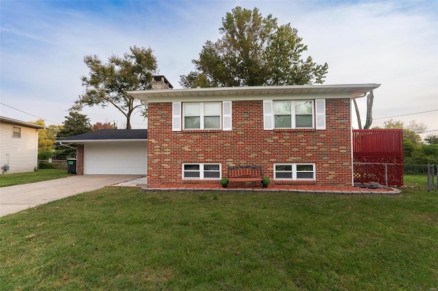 view of front of property featuring a garage and a front lawn