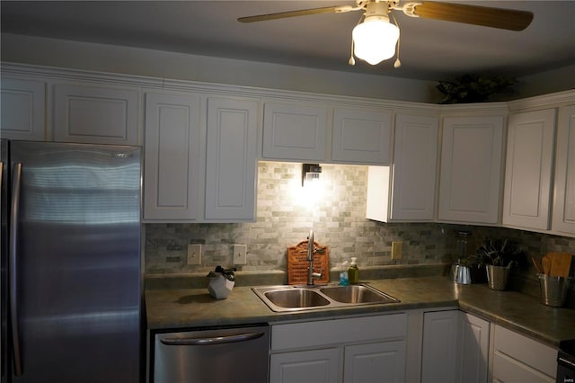 kitchen featuring sink, white cabinets, and appliances with stainless steel finishes