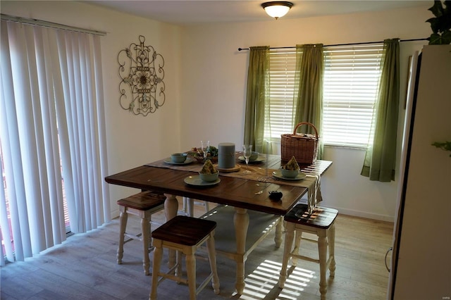 dining space with light wood-type flooring