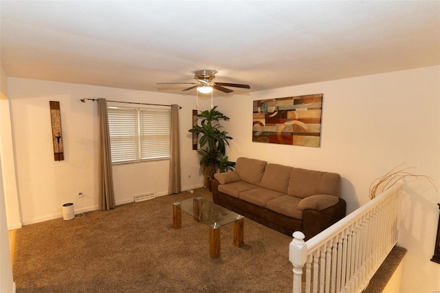 living room featuring carpet and ceiling fan