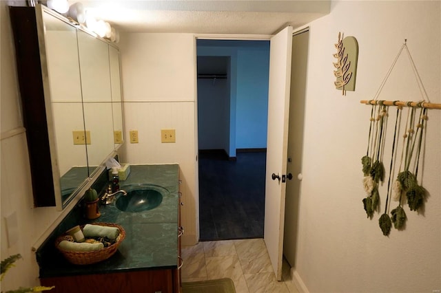 bathroom with vanity and a textured ceiling