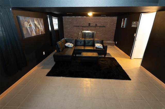 interior space featuring a fireplace, light tile patterned floors, and brick wall