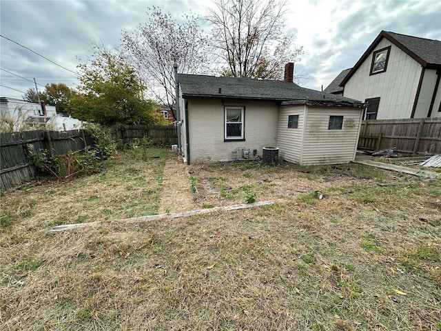 back of property featuring central air condition unit