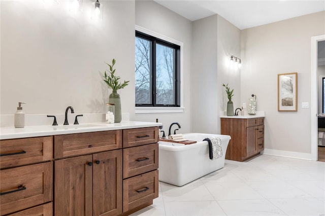 bathroom featuring a washtub and vanity