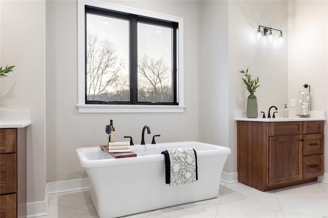 bathroom with vanity and a bathing tub