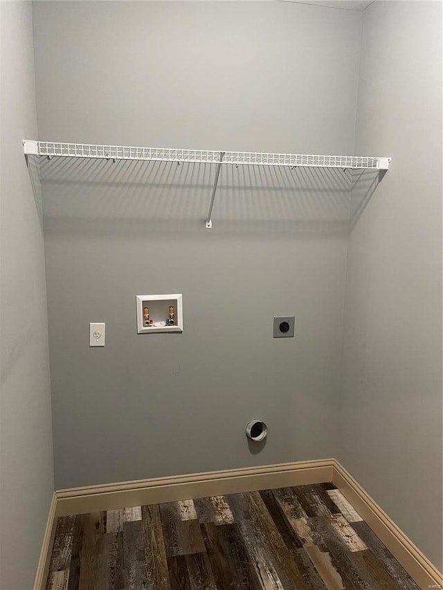 washroom with hookup for an electric dryer, dark hardwood / wood-style flooring, and hookup for a washing machine