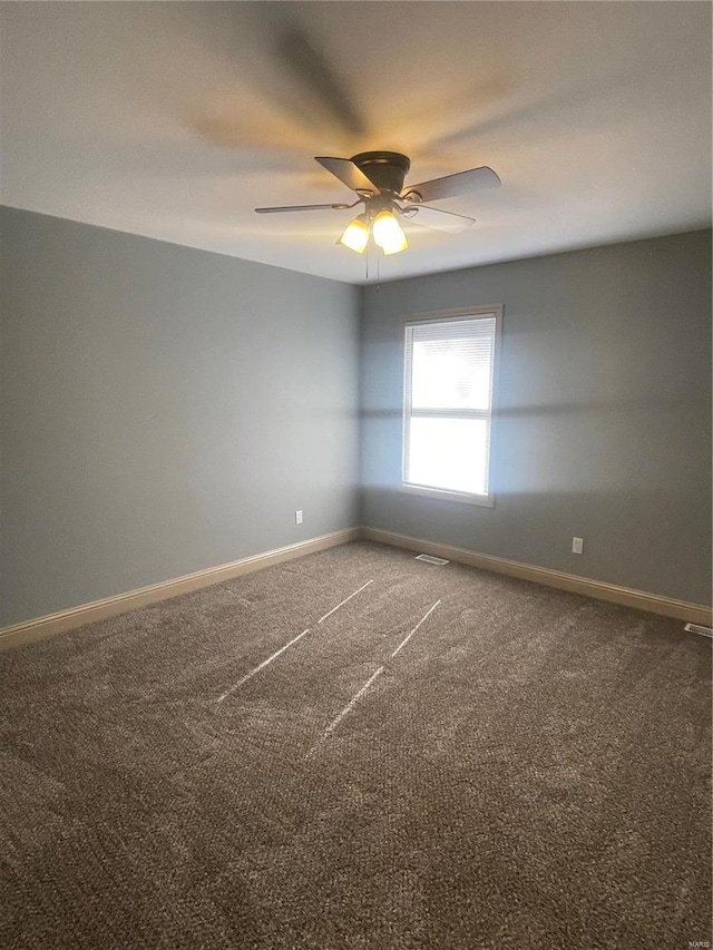 carpeted empty room with ceiling fan