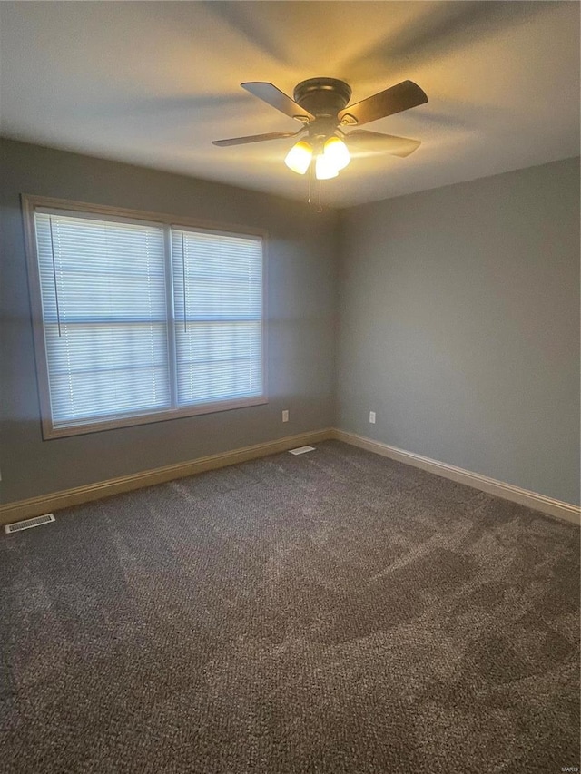 empty room with carpet and ceiling fan