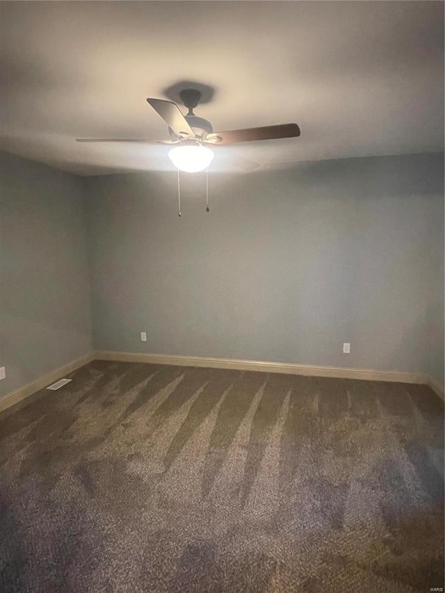 carpeted empty room with ceiling fan