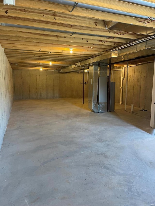 basement with heating unit and water heater