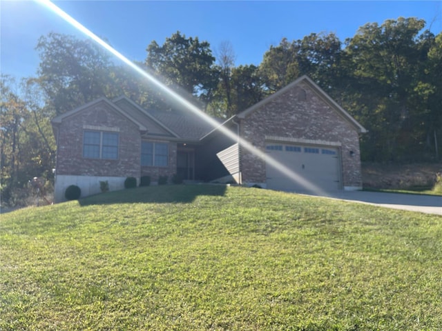 ranch-style home with a front yard and a garage