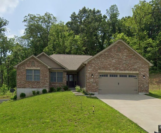 craftsman-style house featuring a front yard and a garage