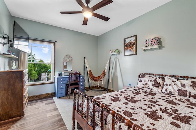 bedroom with ceiling fan and light wood-type flooring