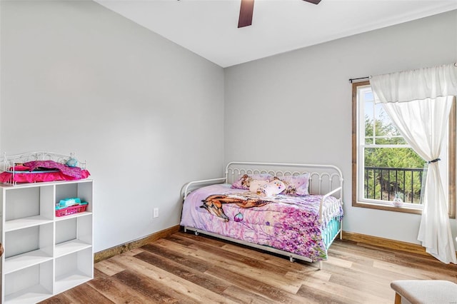 bedroom featuring hardwood / wood-style floors and ceiling fan