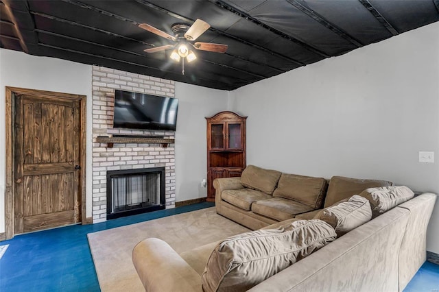 living room with a fireplace, carpet floors, and ceiling fan