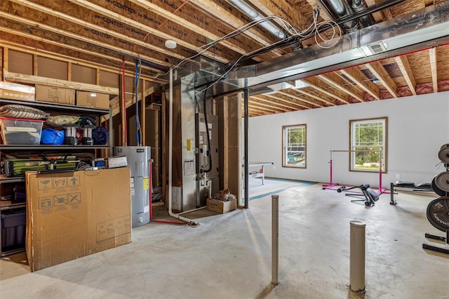 basement with electric water heater and heating unit