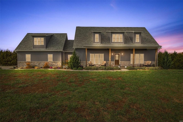 view of front of home with a yard